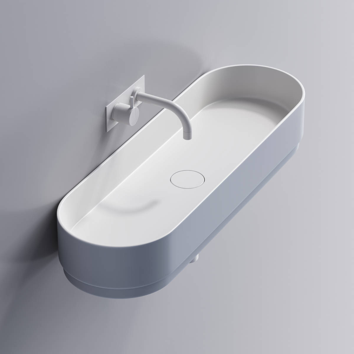 Wall hung wash basin with rounded sides. Matte white on the inside and light blue on the outside.